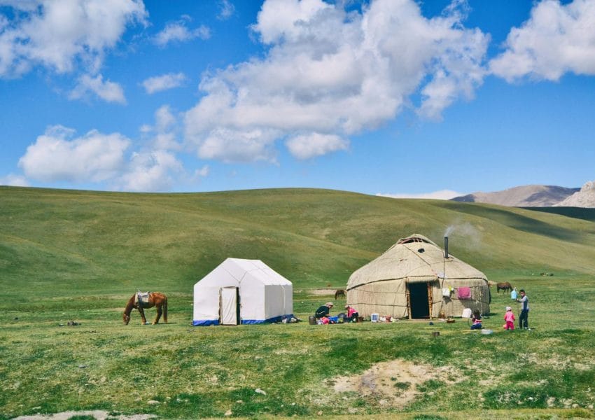 Photo of Hut And Tent On Grass Field